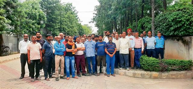 JCT Mill workers stage dharna, want pending arrears cleared