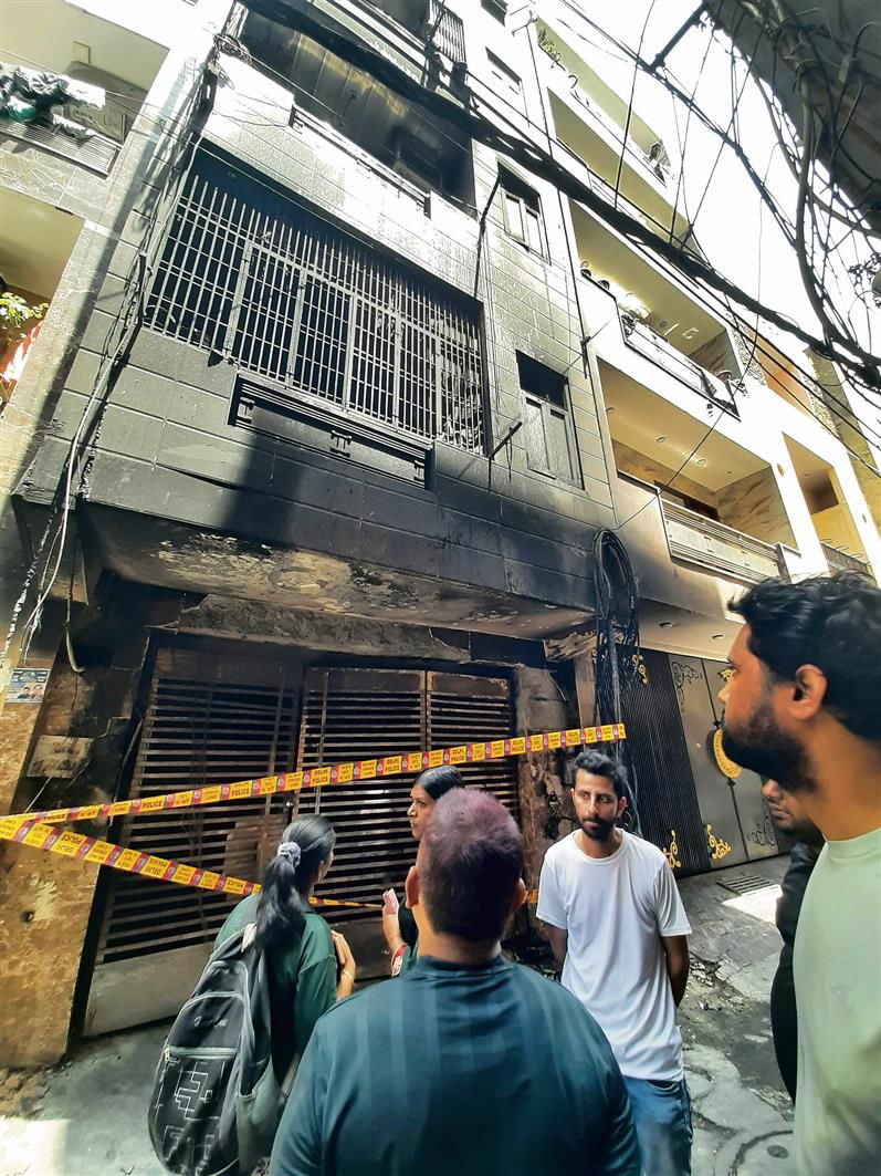 Three killed in residential building fire, owner booked