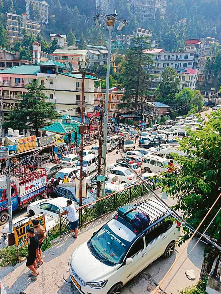 With no place to drive and park, Bhagsunag under tourist siege